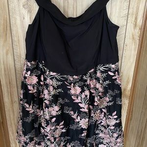 Black off the shoulder cocktail dress.